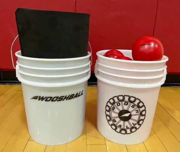 Two WooshBall Buckets holding bases and soft foam balls