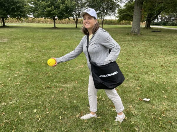 Lady using black WooshBall pitcher's bag